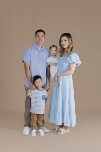 Family of four during a professional family photography session at a Monrovia portrait studio