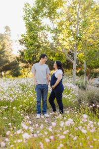 Expecting couple surrounded by wildflowers during a Chino Hills maternity photography session
